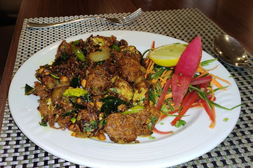Andhra-style chicken fry with curry leaves and peanuts