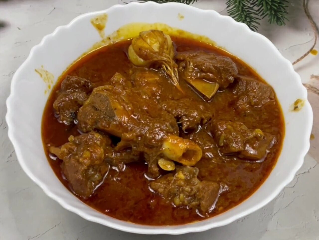 Champaran-style mutton in a dark garlic gravy