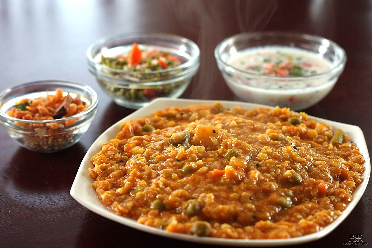 Bisi bele bath served hot with boondi and raita