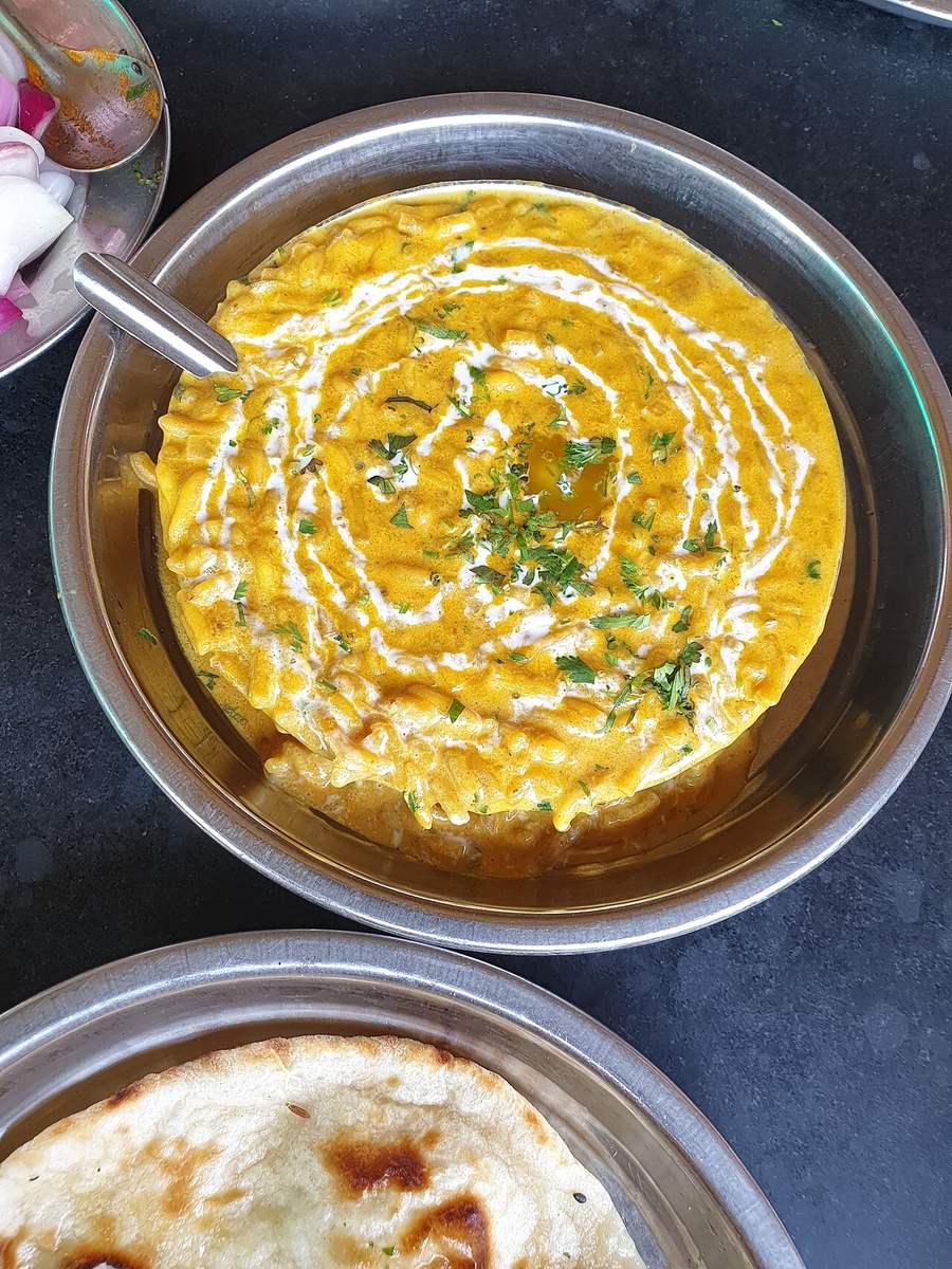 Dal tadka finished with cream and coriander, served with naan