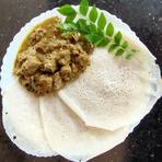 Appam served with a curry