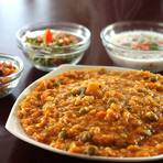 Bisi bele bath served hot with boondi and raita