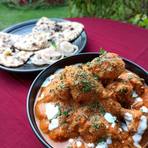 Butter chicken served with butter naan