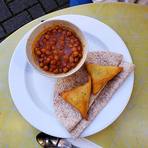 Chana masala served with roti and samosa