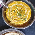 Dal tadka finished with cream and coriander, served with naan